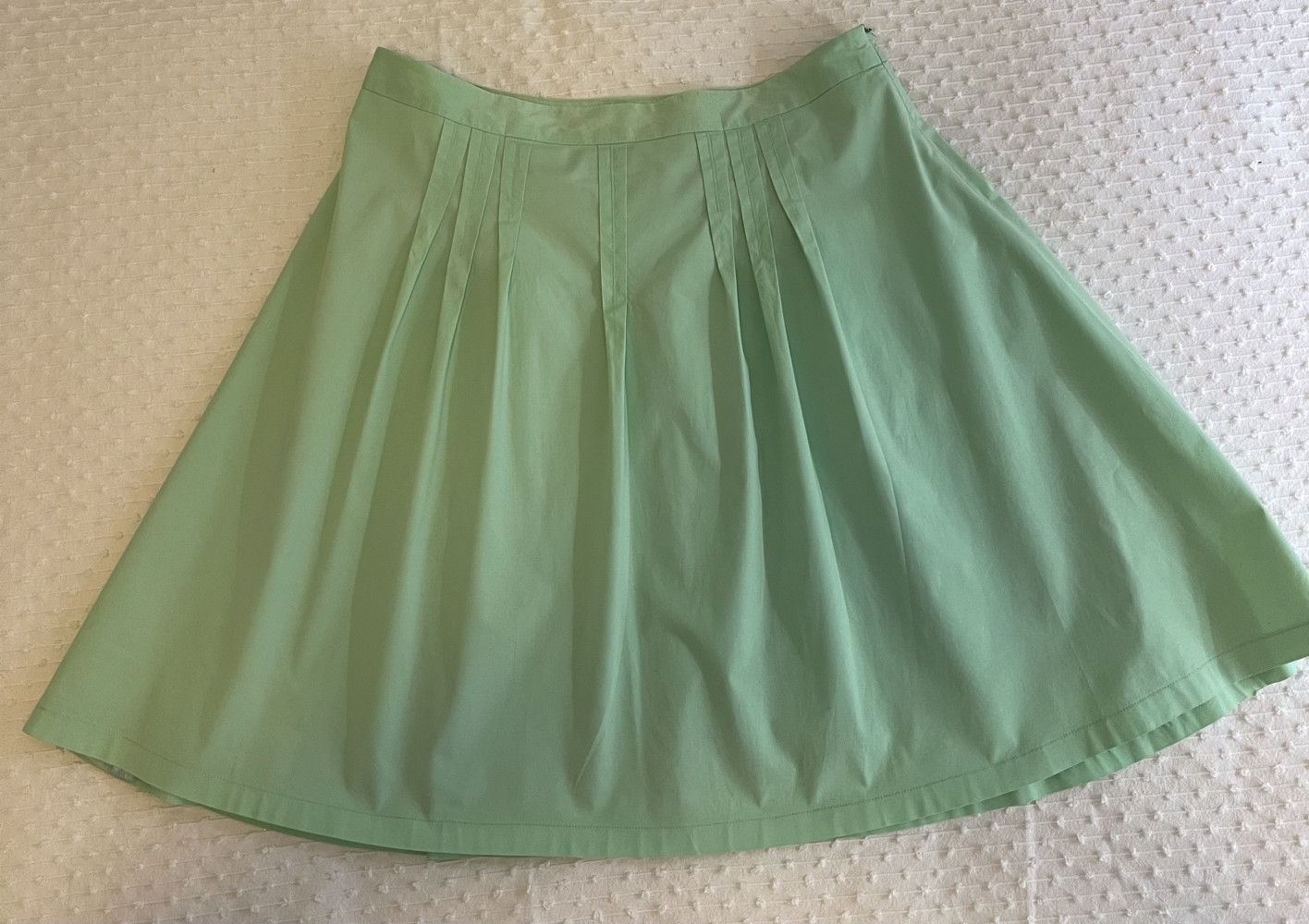 Pale green pleated skirt