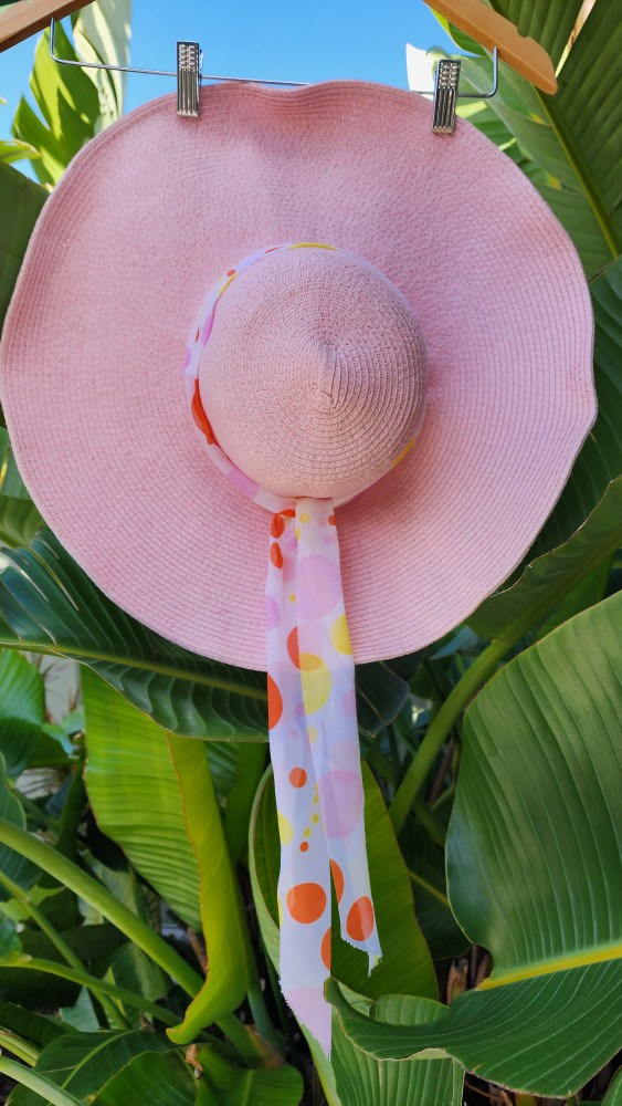 Large pink floppy sun hat