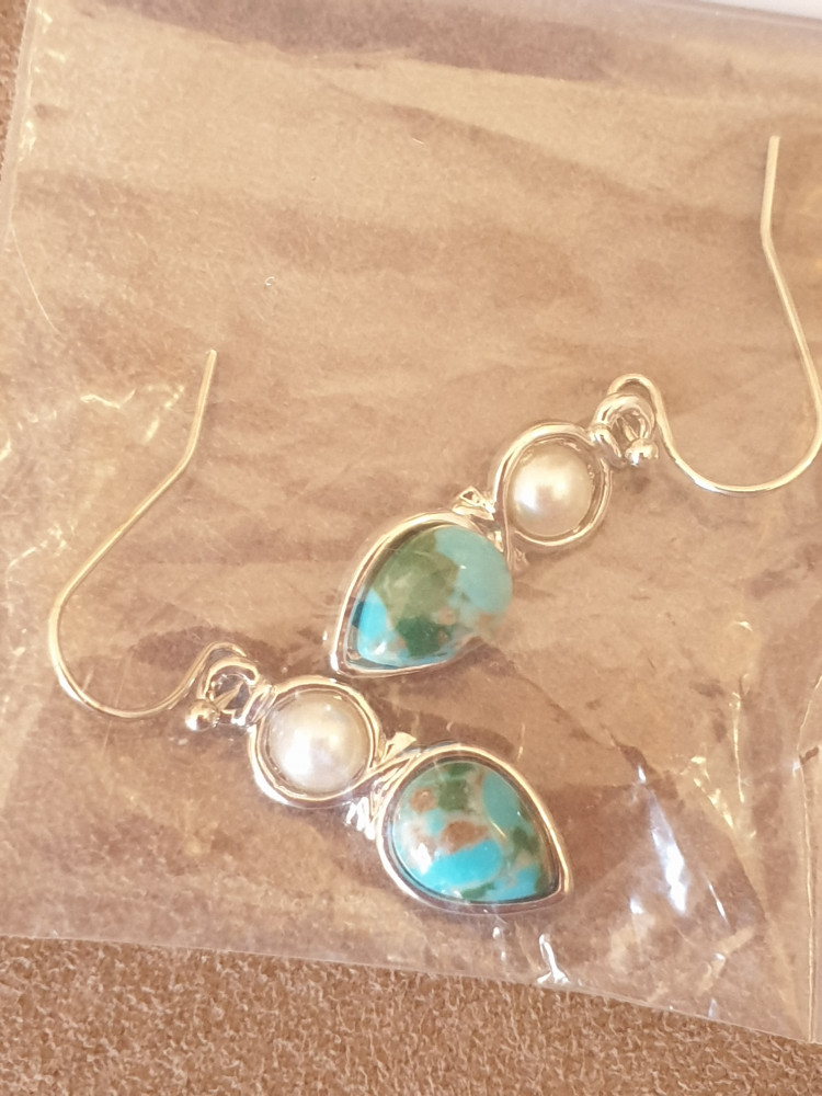 Stirling Silver dangly earrings with a pearl and blue stone